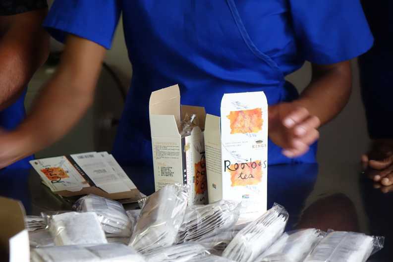 Rooibos Tea Packaging on Klipfontein Farm Workers on the Klipfontein Farm pack airtight-sealed Rooibos tea bags into branded packaging with the name Kings Products.