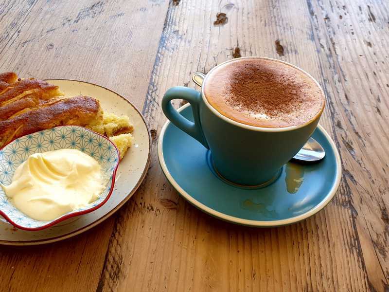 Red cappuccino made with rooibos espresso and milk foam